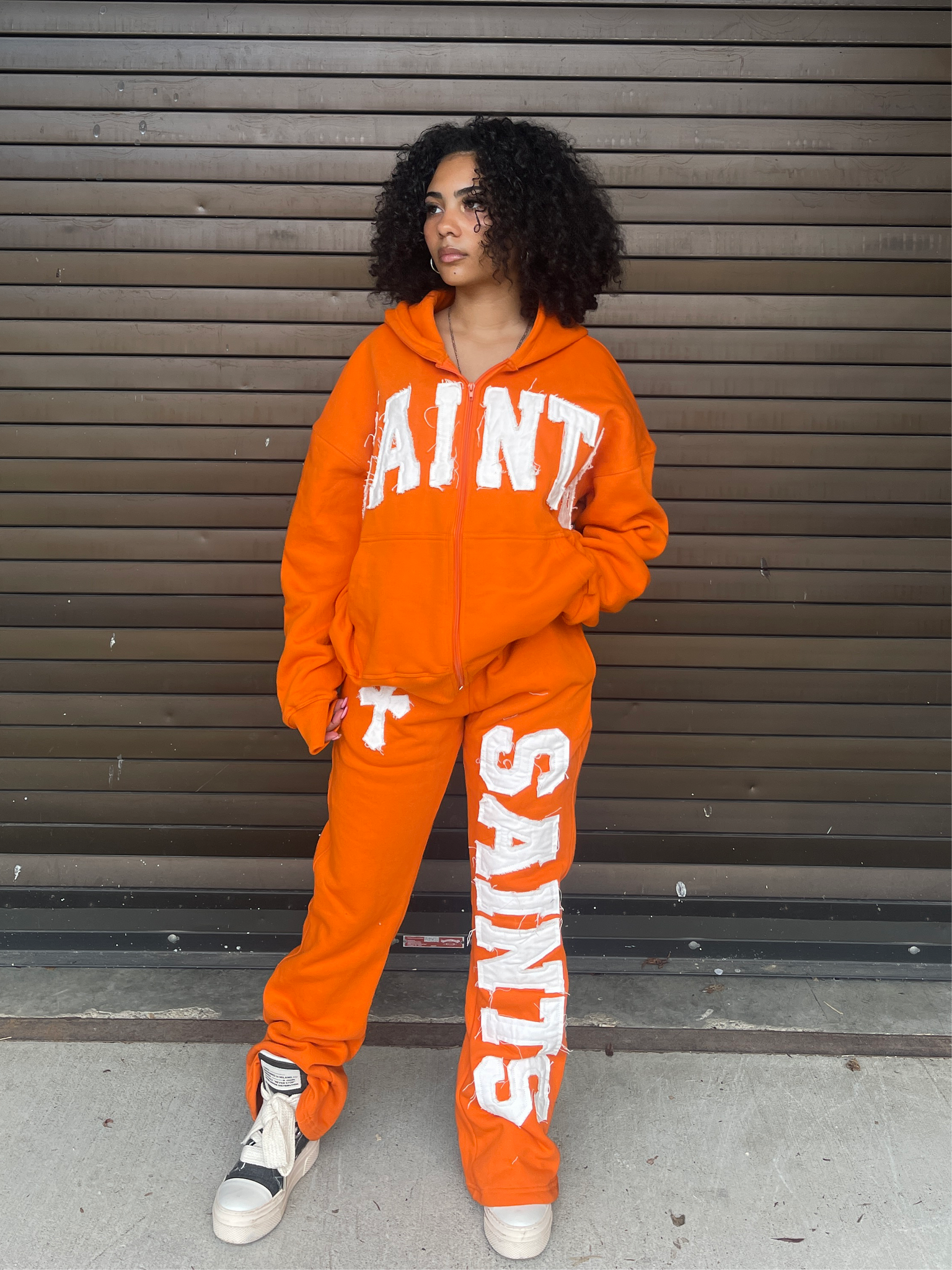 ORANGE FLARED SWEATS