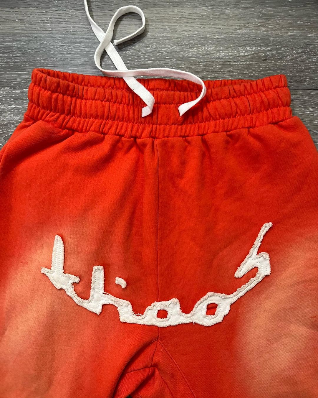 KHAÖS FLARED SWEATPANTS ORANGE