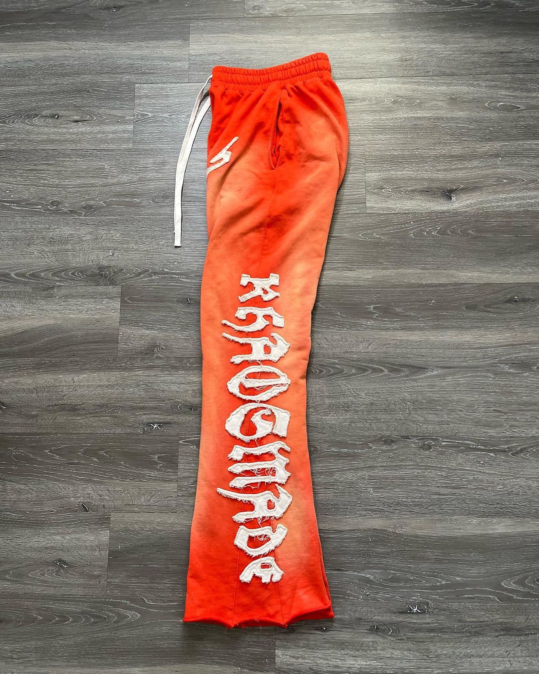 KHAÖS FLARED SWEATPANTS ORANGE